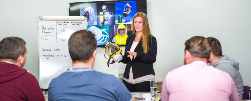 woman giving presentation of asbestos rebreather equipment