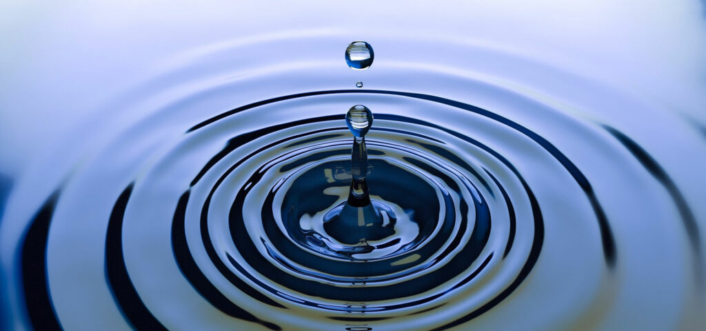 drop of water in a pool rippling